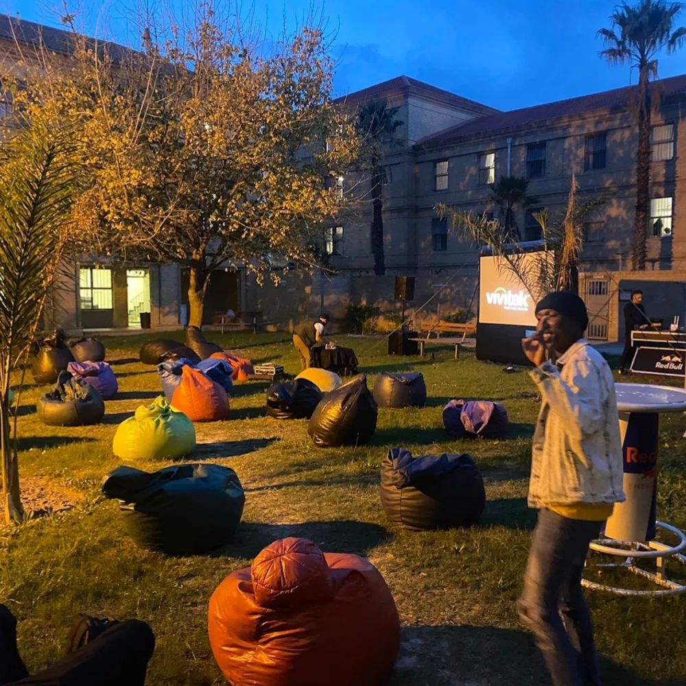 Cape Peninsula University of Technology Outdoor Event Students gather on beanbags for an outdoor evening screening event at Cape Peninsula University of Technology.